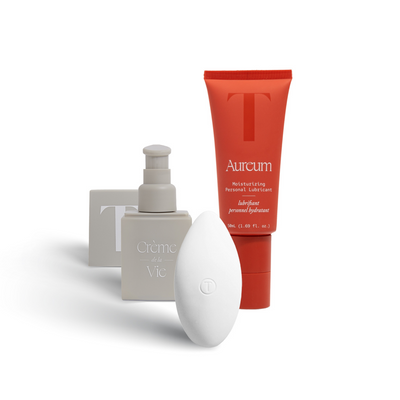 A picture of the products in the Weekender bundle: Creme de la Vie vulva moisturizer, the Pearl massager, and Aureum lubricant.