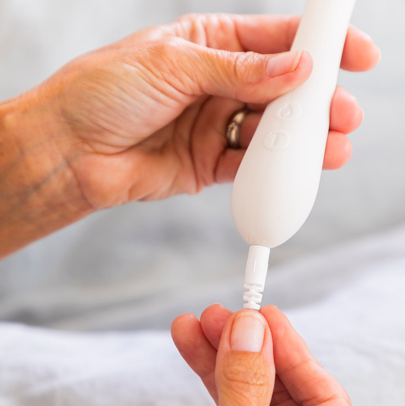 A woman charging the Nuri massager
